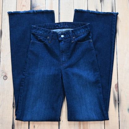 Kimes Ranch Olivia dark wash wide-leg jeans with raw hem and high-rise fit.