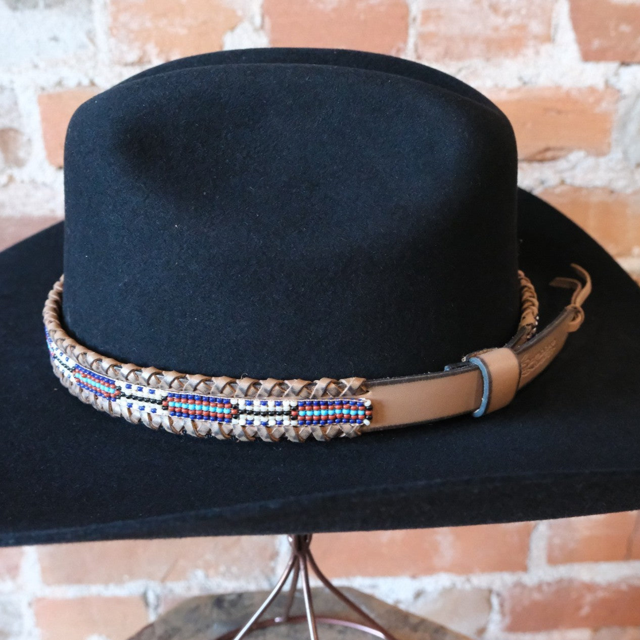 Adjustable Sambboho beaded hatband on a western felt hat at Atomic 79.