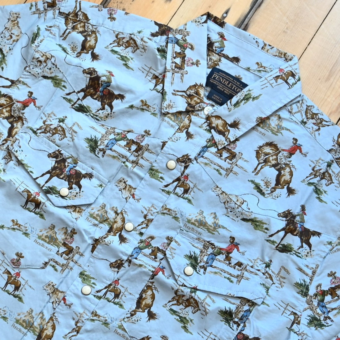 Men’s short-sleeve Laramie shirt in Wild Horses pattern with snap front, peaked yokes, and classic fit