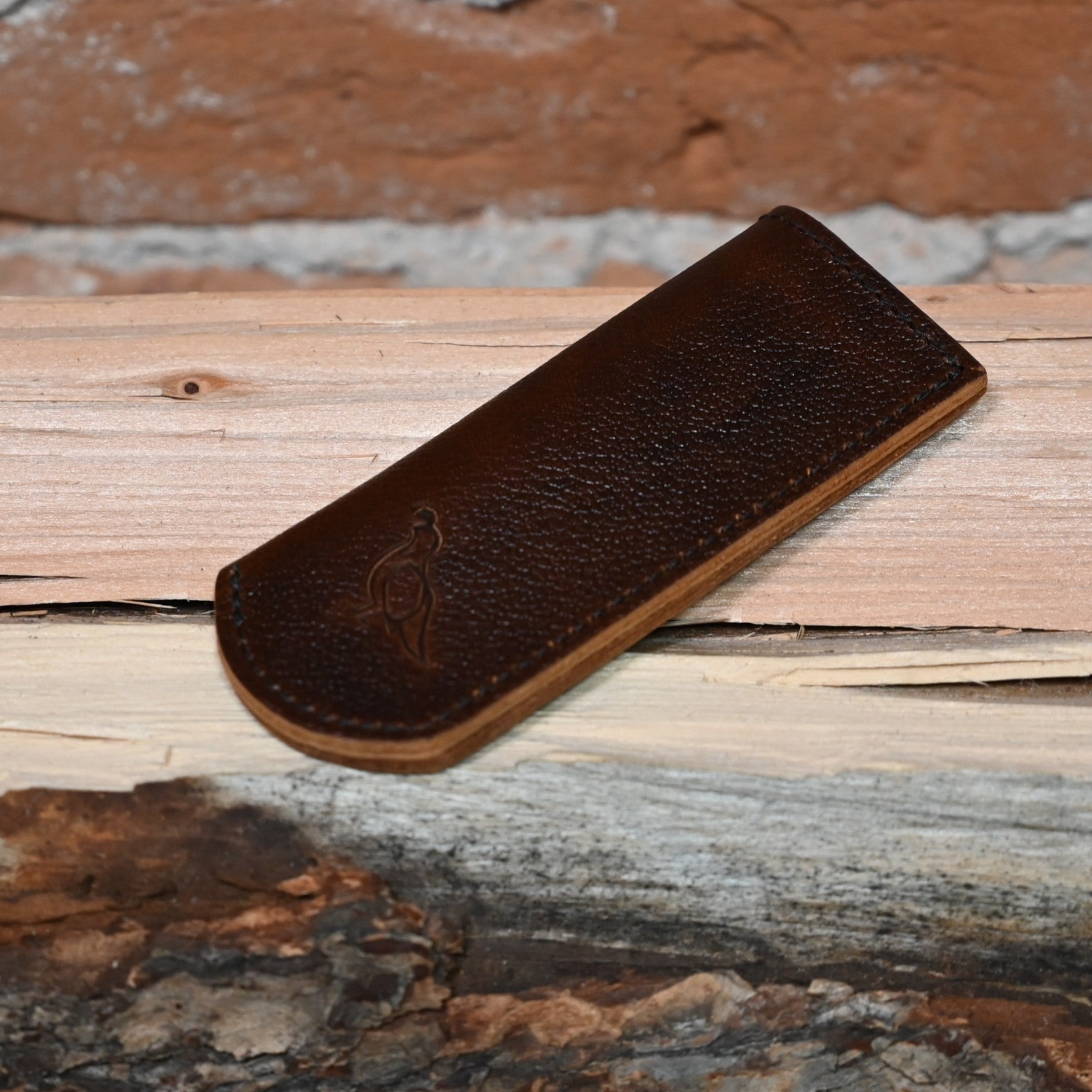 View of Smithey Ironware Leather Skillet Sleeve – Standard, crafted from oil-tanned leather to protect your hands from hot skillet handles