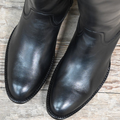 View of Stallion Ladies 16&quot; boots showcasing black French calf vamp and top with B toe and leather stacked heel