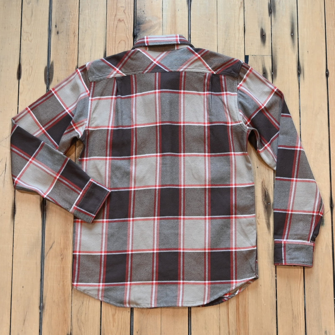 Filson Vintage Flannel Work Shirt in tan and orange multi-plaid with button-front pockets and brushed interior