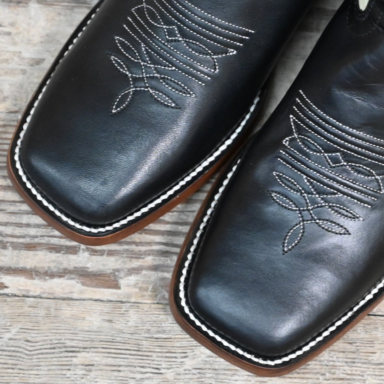 View of Hondo 11&quot; cowboy boot with bone leather top, black steer vamp, and wide square toe