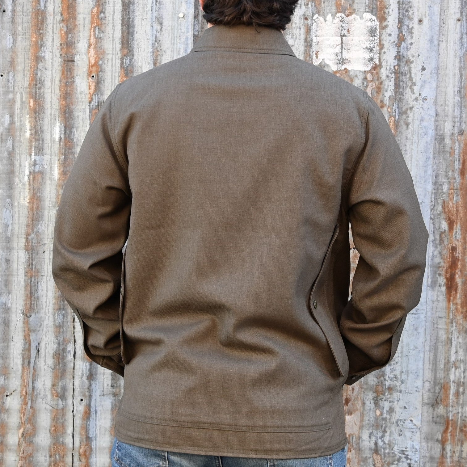 View of Filson Forestry Cloth Cruiser Jacket featuring four front cargo pockets and snap-front closure