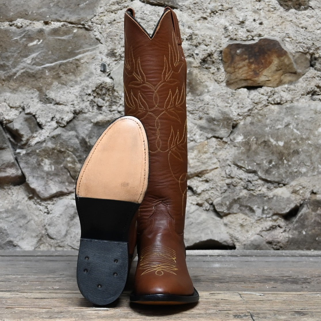 View of Front and Sole of Olathe 17&quot; Tall Leather Polo Style Boots with Brown Mule Vamp and Roper Heel with Yellow Toe Bug Stitching.