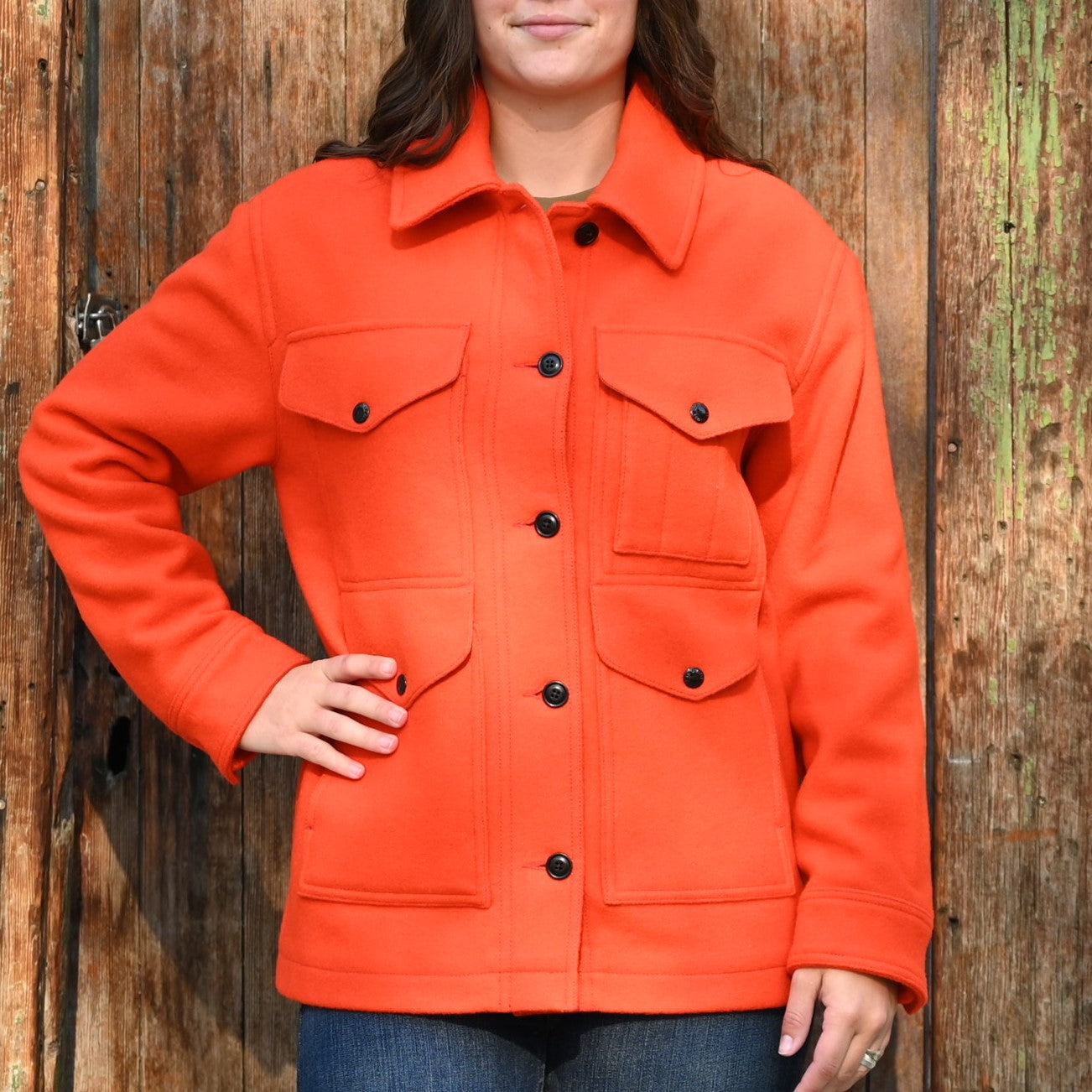View of Filson Ladies Mackinaw Cruiser in Flame featuring four front cargo pockets and a double-layer back
