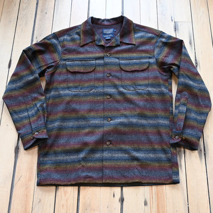 View of Pendleton men’s wool board shirt in brown multi ombré stripe with bias pockets and square hem