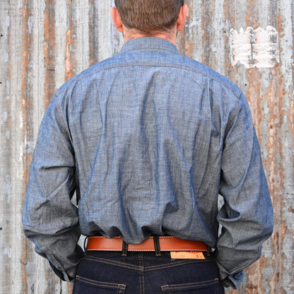 View of Filson Chambray CPO Shirt in Rinsed Indigo and Light Indigo featuring button-secure chest pockets and knife pleats for enhanced mobility