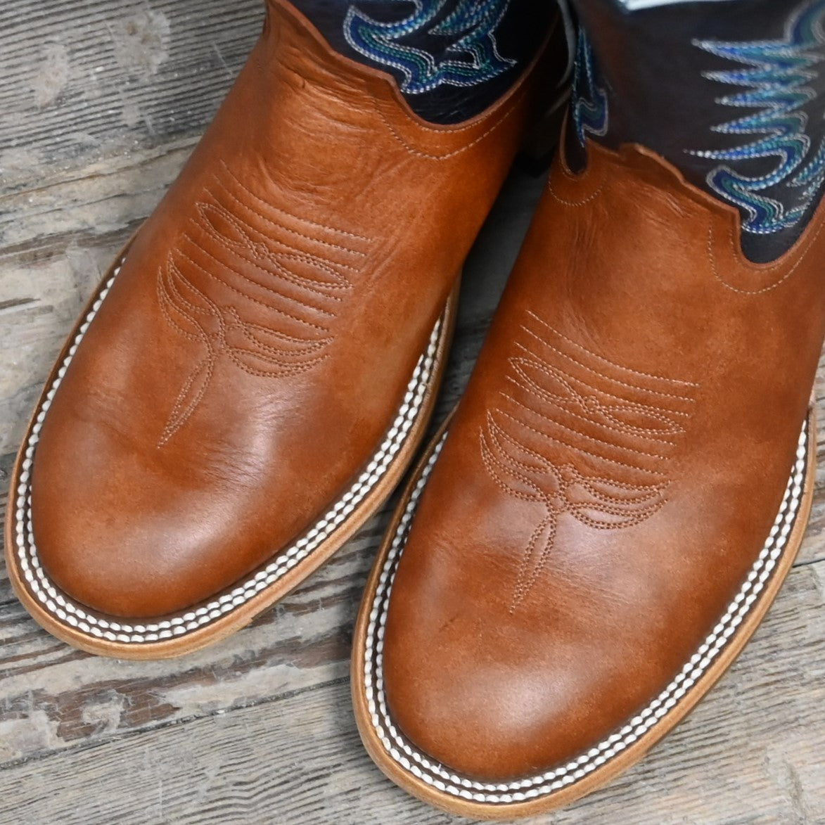 View of Horse Power 11&quot; boot with navy goat top, cognac Belton vamp, medium round toe, and pull straps