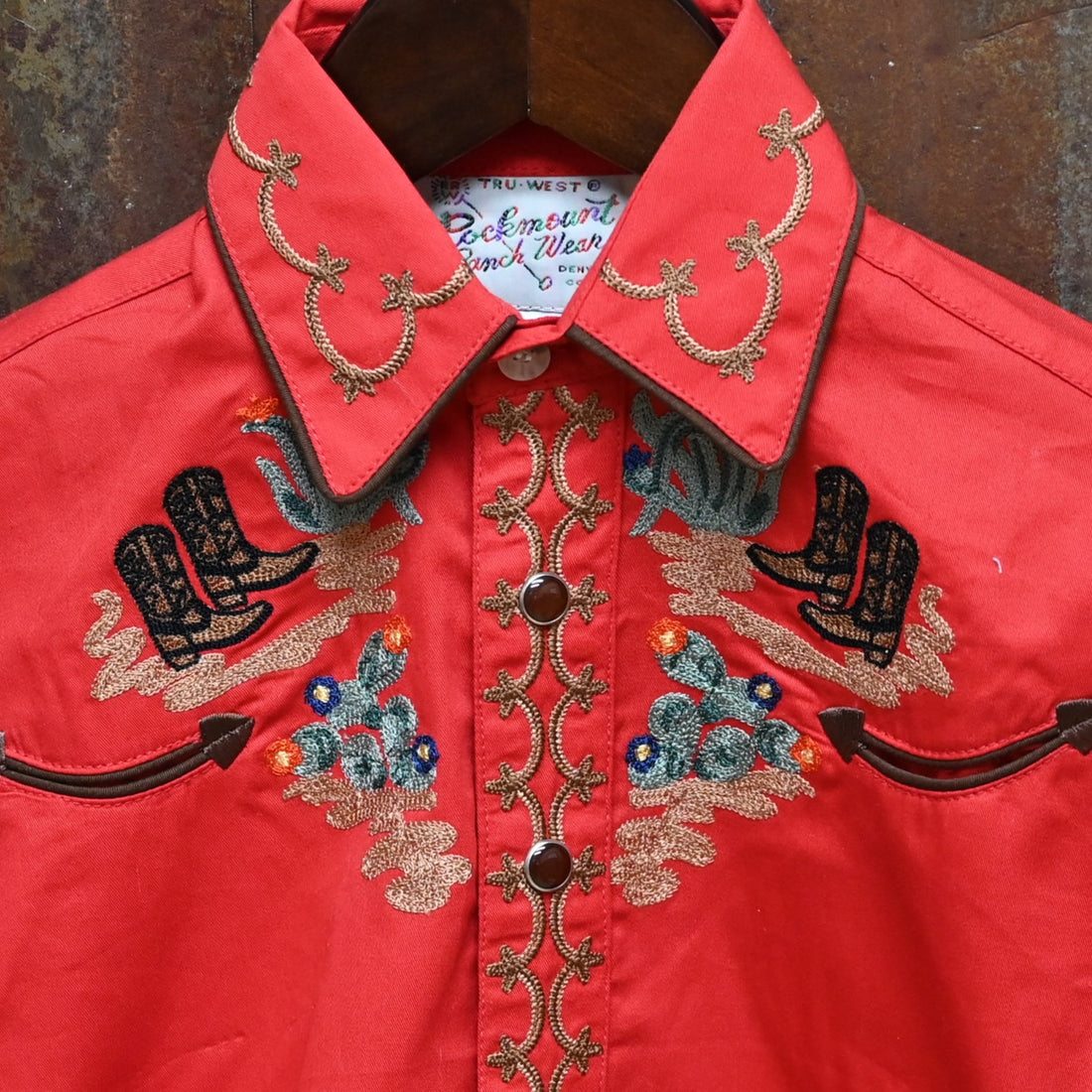 View of Red Rockmount kids western shirt with cactus and boot embroidery and Western piping