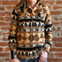 View of Tan and black fleece Western shirt with Native geometric pattern and snap closures