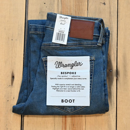 View of Wrangler Ladies boot cut jeans in Ada wash with high-rise fit from the Bespoke Collection