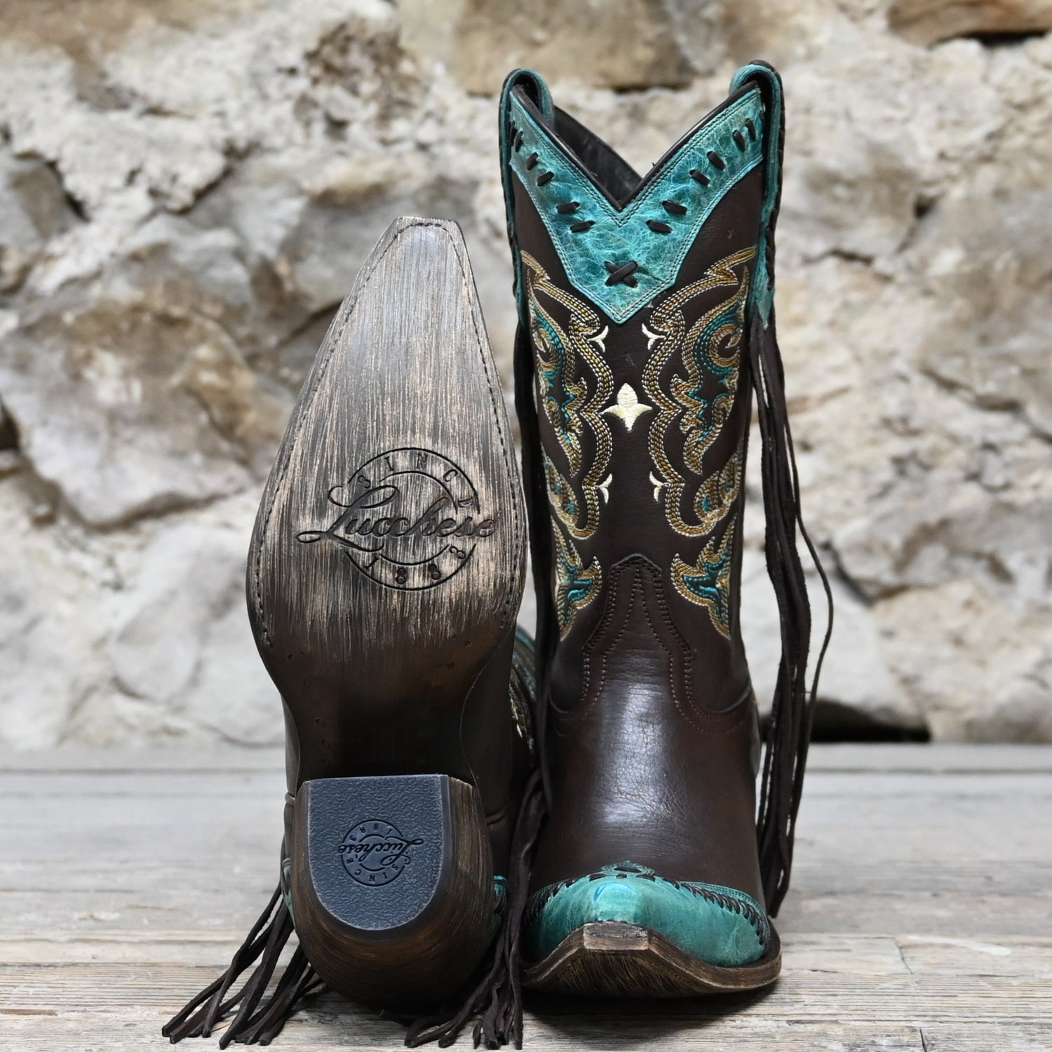 View of Lucchese ladies 11″ boot in chocolate leather with powder blue toe and collar, buckstitch trim, and tassel