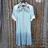 View of Double D Ranch Senoritas Rodeo Dress in Celestial Sky featuring embroidered floral print, pearl snap button closure, and drawstring waist