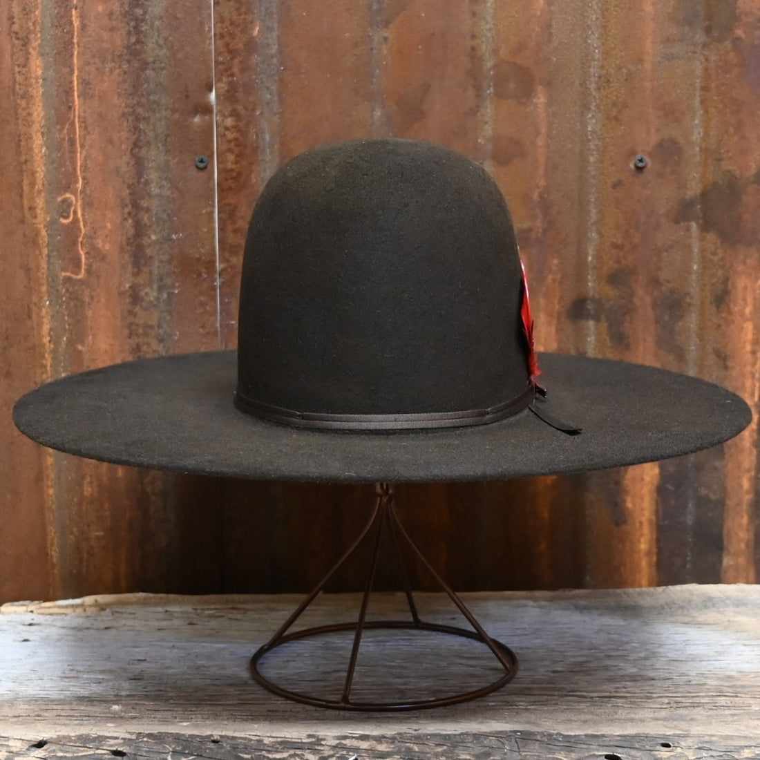 View of Front of Resistol Chute in Chocolate with Open Crown and Red Feather.