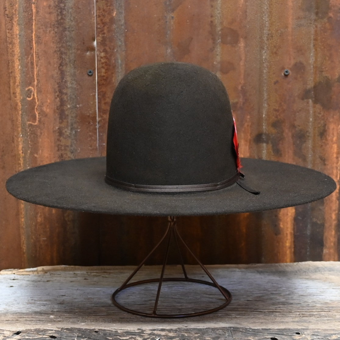 View of Front of Resistol Chute in Chocolate with Open Crown and Red Feather.