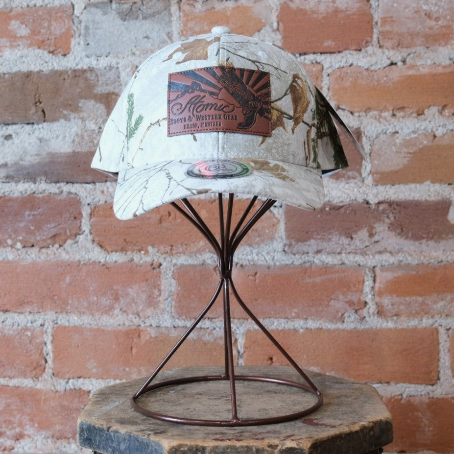 Atomic 79 Snow Camo hat with leather sunrise patch.