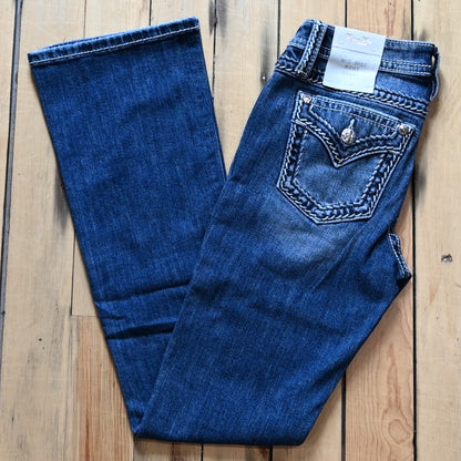 Miss Me Mid Rise Boot Cut Ladies Jean with boot cut leg and embroidered back pockets