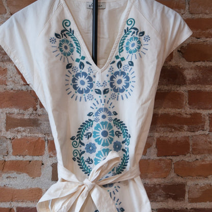 Sendero Provisions Co. The Emilia Dress in Ivory-Teal with floral embroidery.