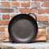 View of Smithey 12" Carbon Steel Round Roaster – Hand-forged pan with hammered handles and pre-seasoned interior