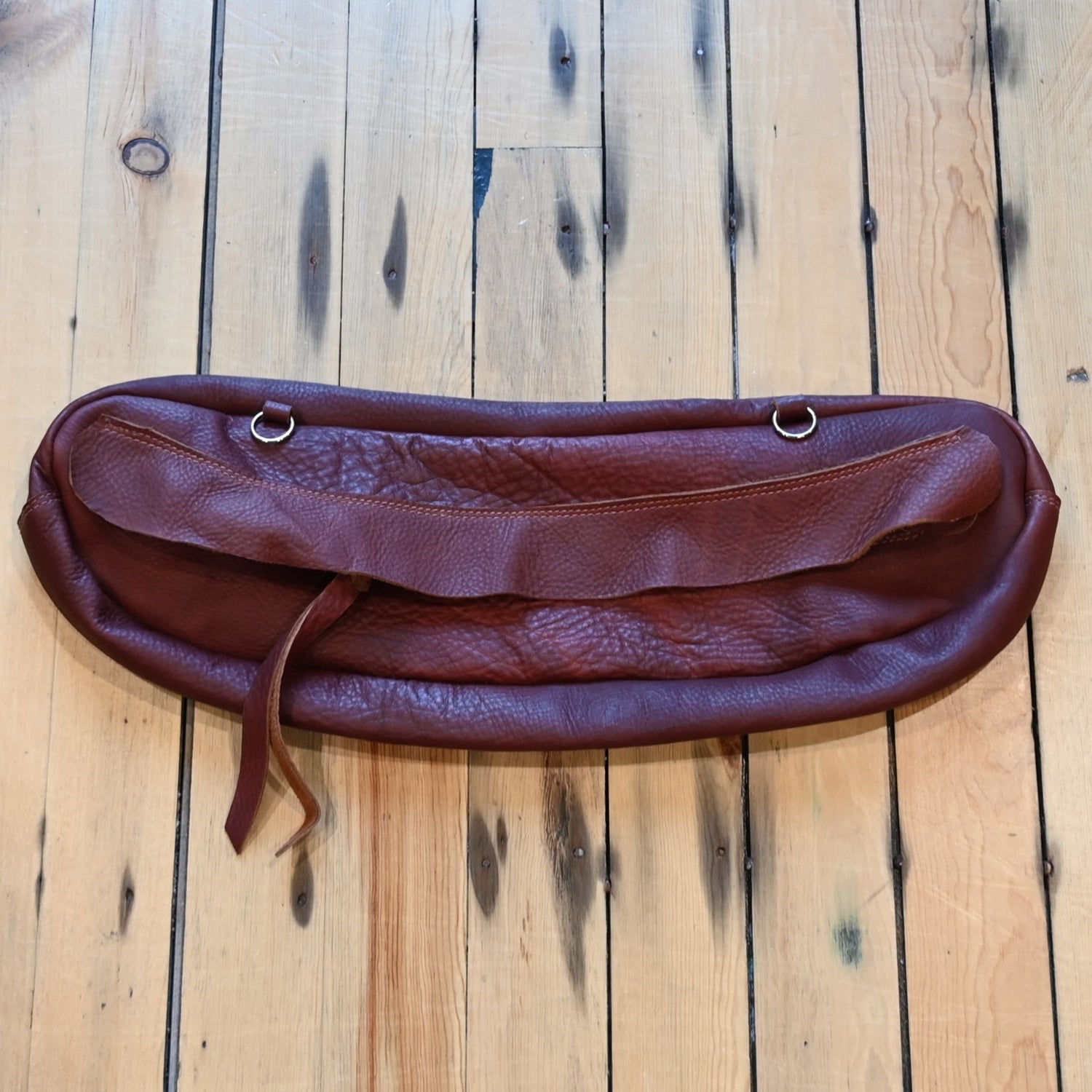 View of K Bar J chap leather cantle bag with brass zipper and loops