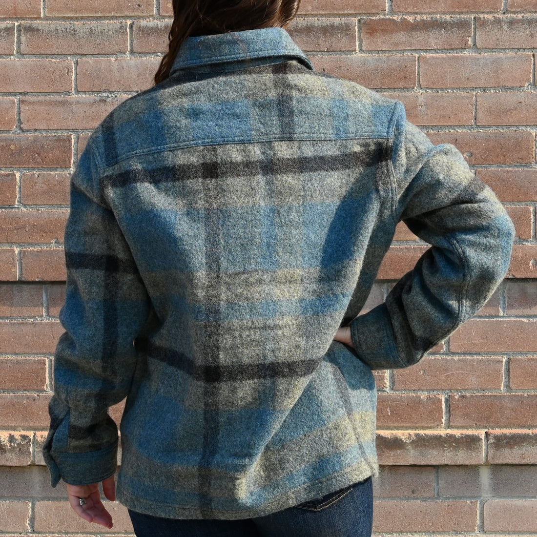 View of Filson Ladies Wool Overshirt in Ballard Plaid featuring button-front closure and adjustable cuffs